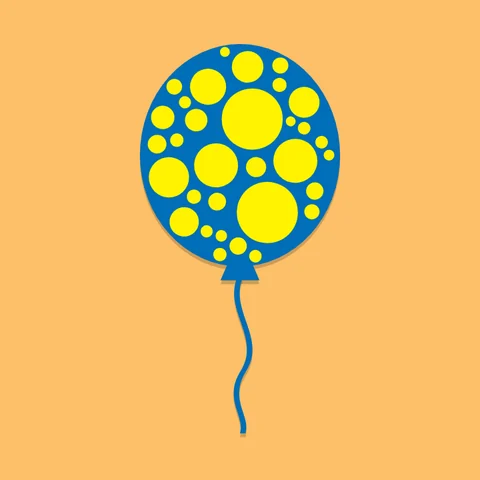 A blue balloon covered in yellow dots, on orange
