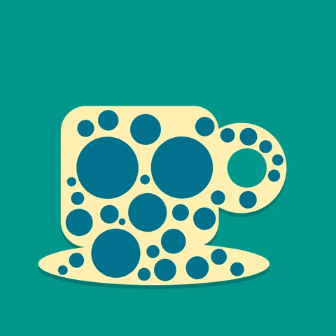 A cream cup covered in blue dots, on teal